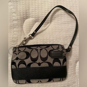 Black Coach wristlet in classic ‘C’ print